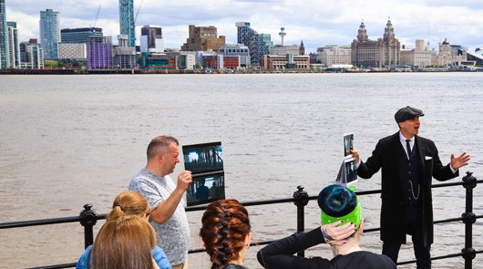 Peaky Blinders Tour Liverpool - Guide with Liverpool behind him